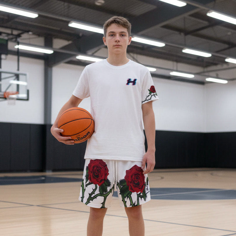 Person holding a basketball in an indoor gymnasium